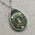 Henderson tartan oval pendant necklace with clan crest and Latin motto.