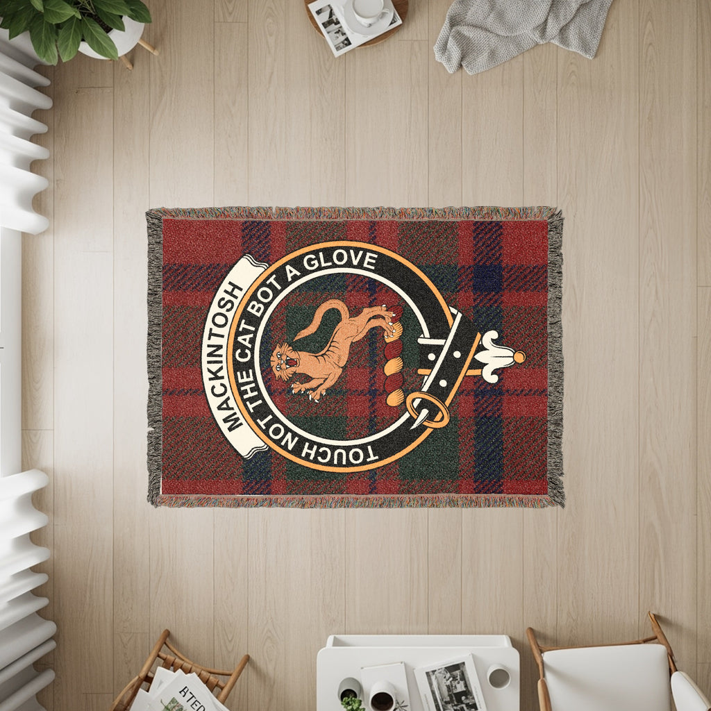 Tapestry showing Mackintosh clan crest on red and blue plaid with text "Touch Not the Cat Bot A Glove".