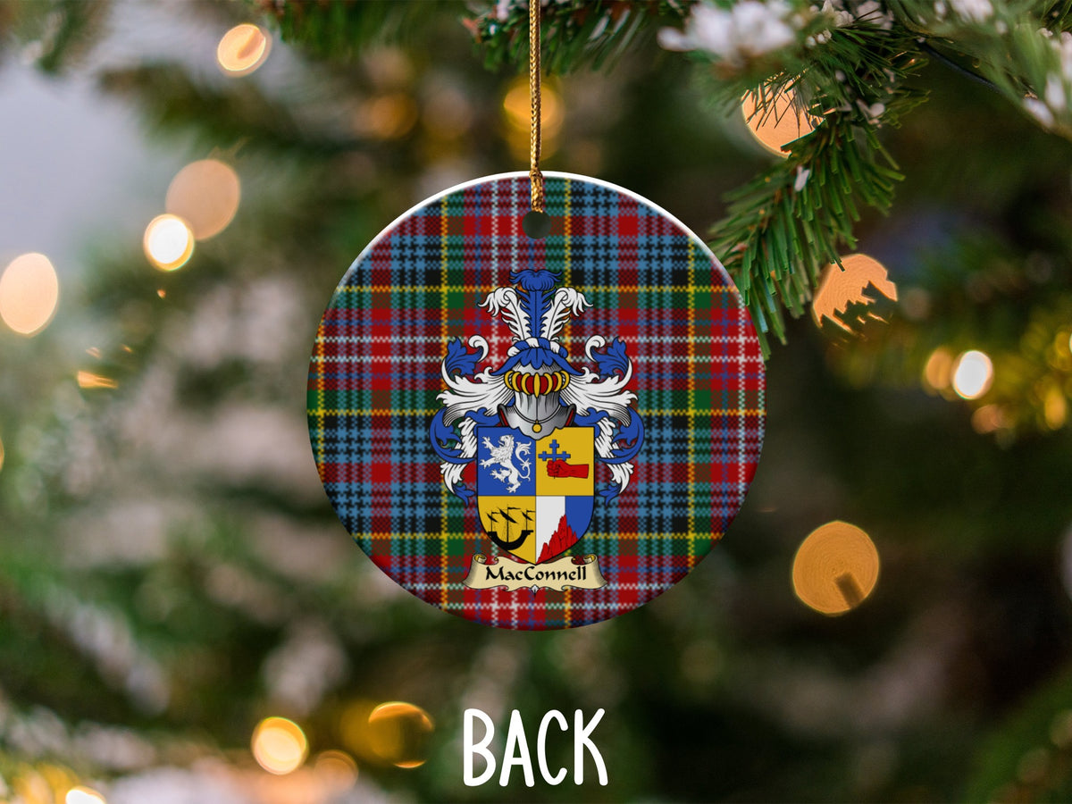 MacConnell ceramic ornament detail showing a double-sided family shield on a Caledonia tartan background