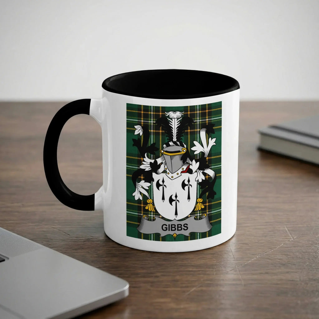 White mug with black rim displaying a coat of arms with "Gibbs" text.