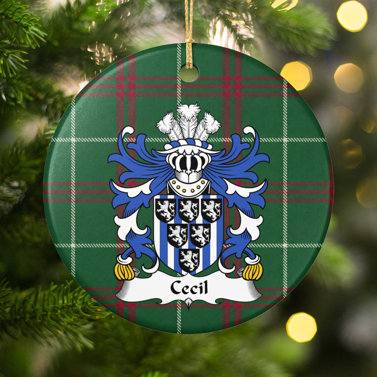 Cecil ornament hanging among Christmas tree branches and warm lights; six small black shields bearing white lions over blue-and-white vertical stripes on Welsh national tartan.