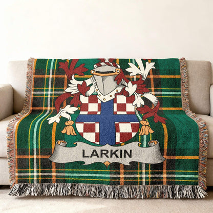 Larkin family crest on a green plaid blanket with fringe.