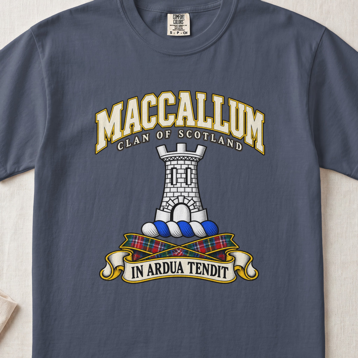 MacCallum Scottish clan T-shirt in Midnight, front view with a silver stone tower and motto design.