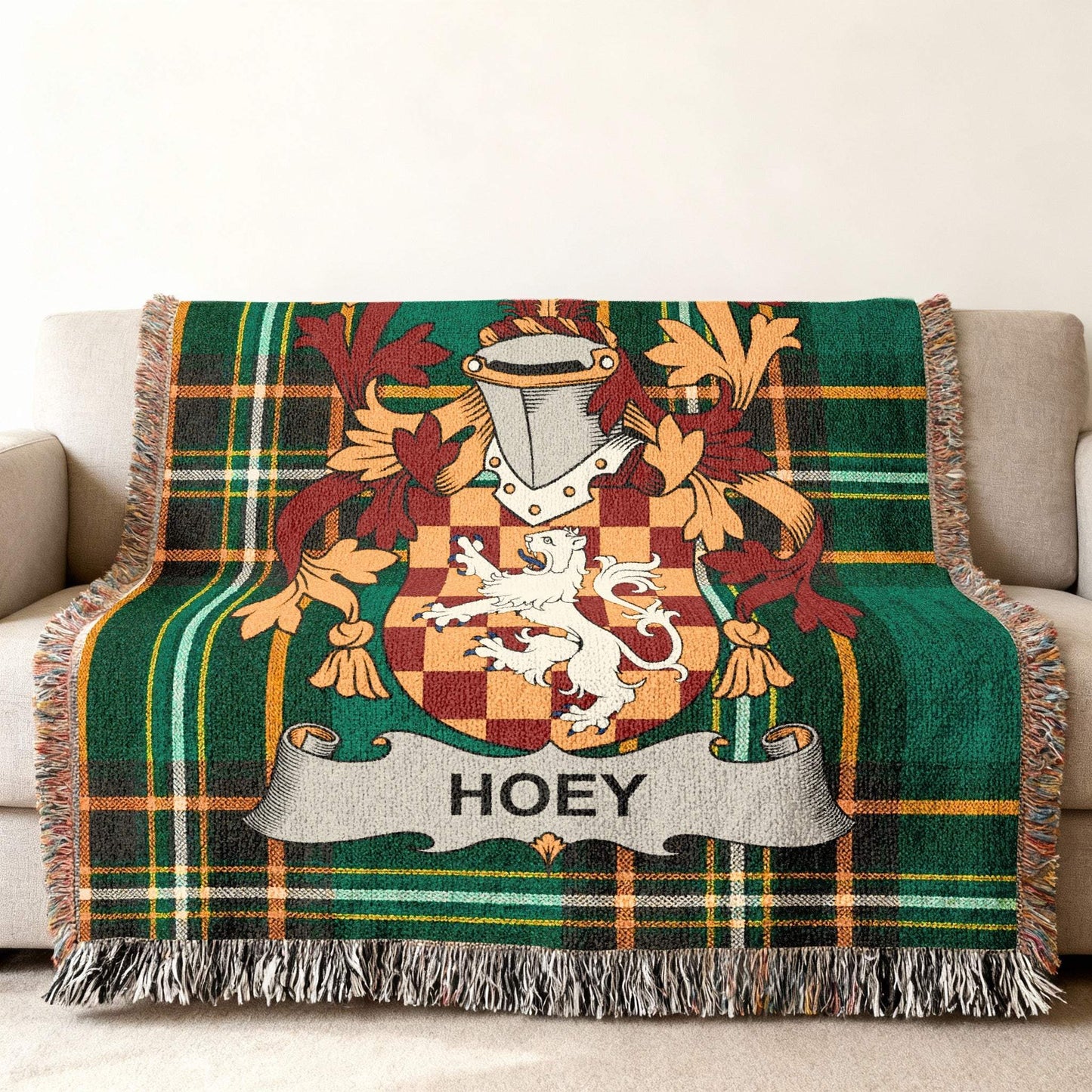 Tartan blanket with the HOEY family crest, featuring a lion and shield.