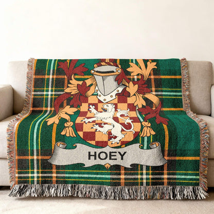 Tartan blanket with the HOEY family crest, featuring a lion and shield.