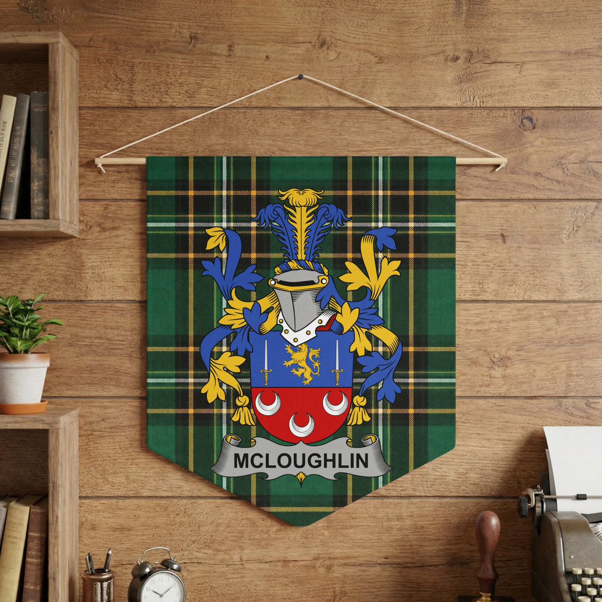 McLoughlin family crest on green tartan pennant hanging on wood-paneled wall.