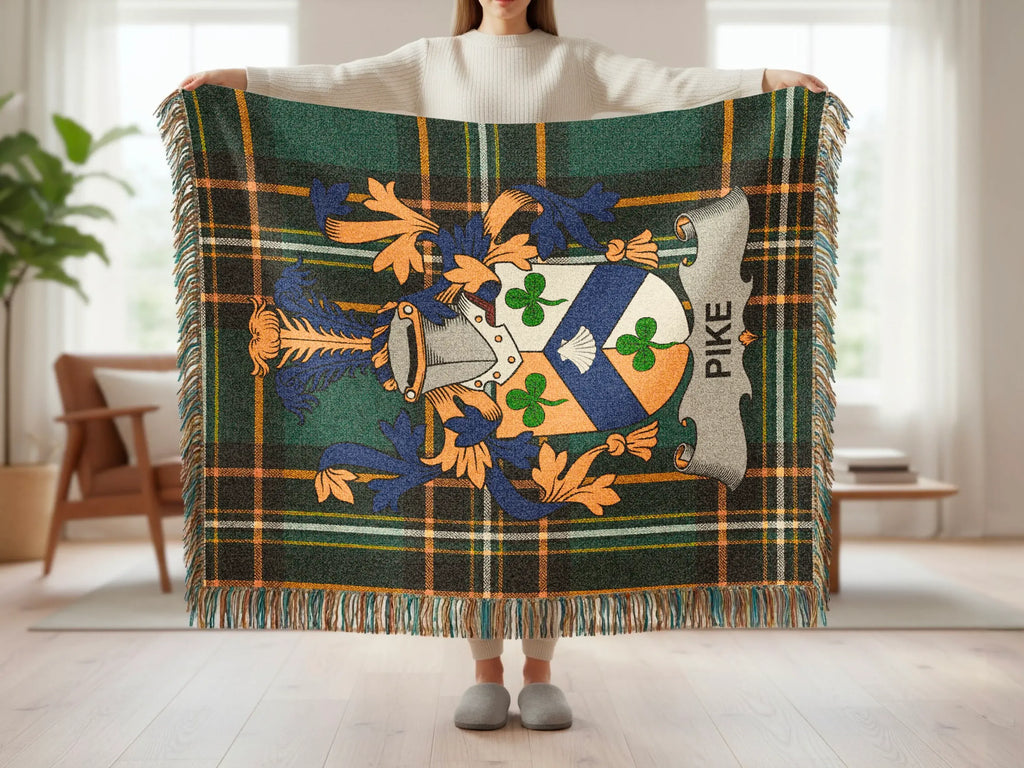 Plaid blanket with crest featuring "PIKE" text and Celtic knot design.