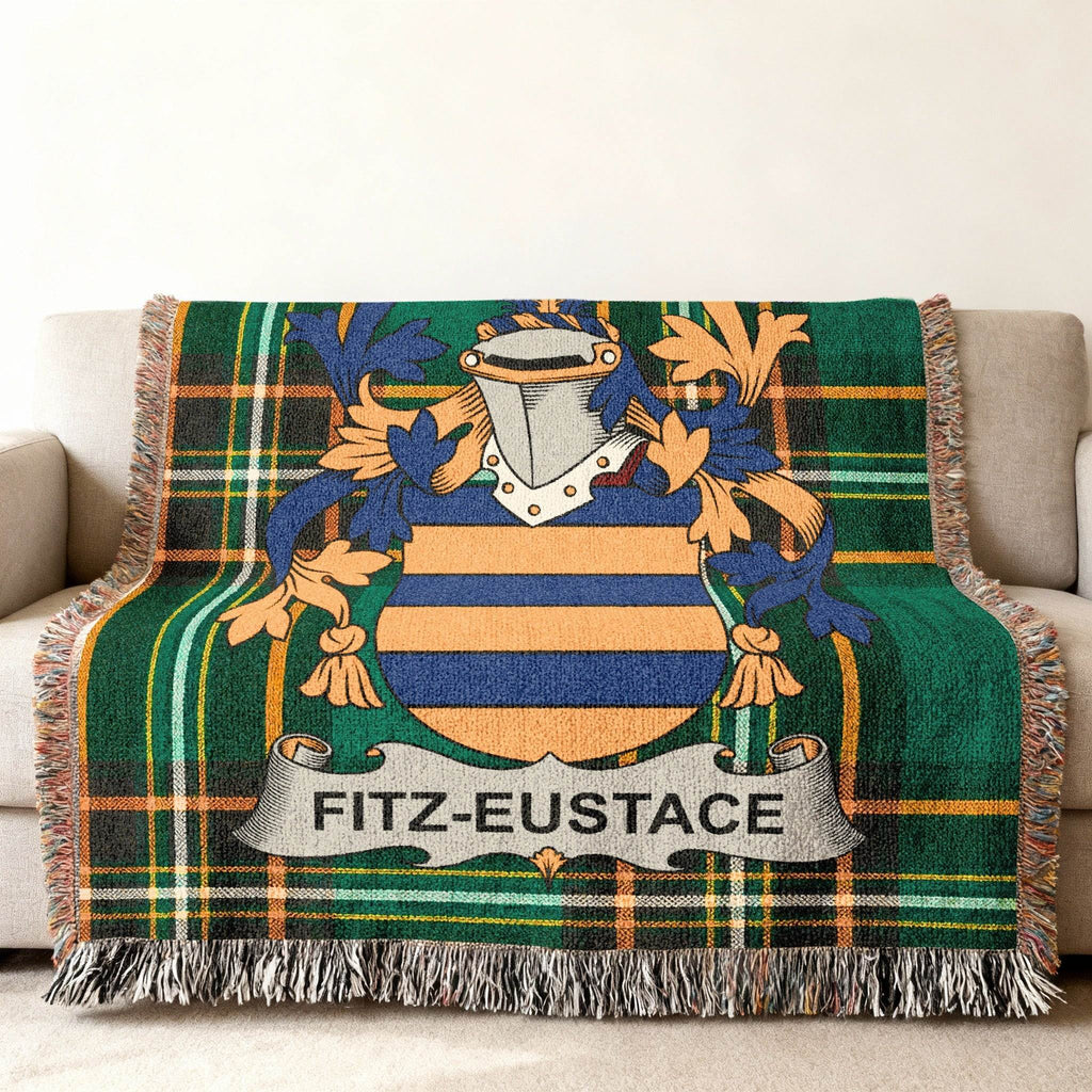 Fitz-Eustace family crest on a green plaid woven throw blanket.