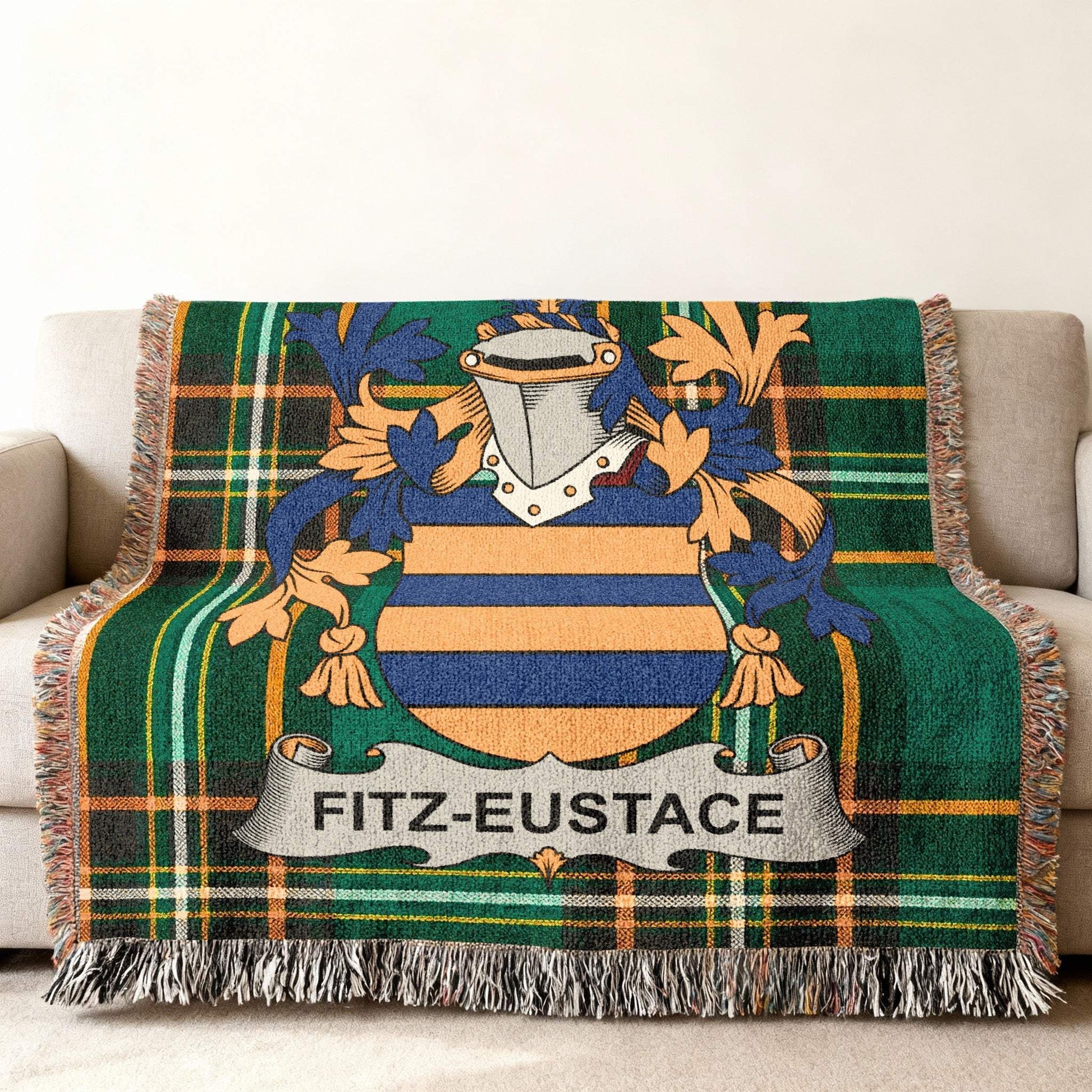 Fitz-Eustace family crest on a green plaid woven throw blanket.