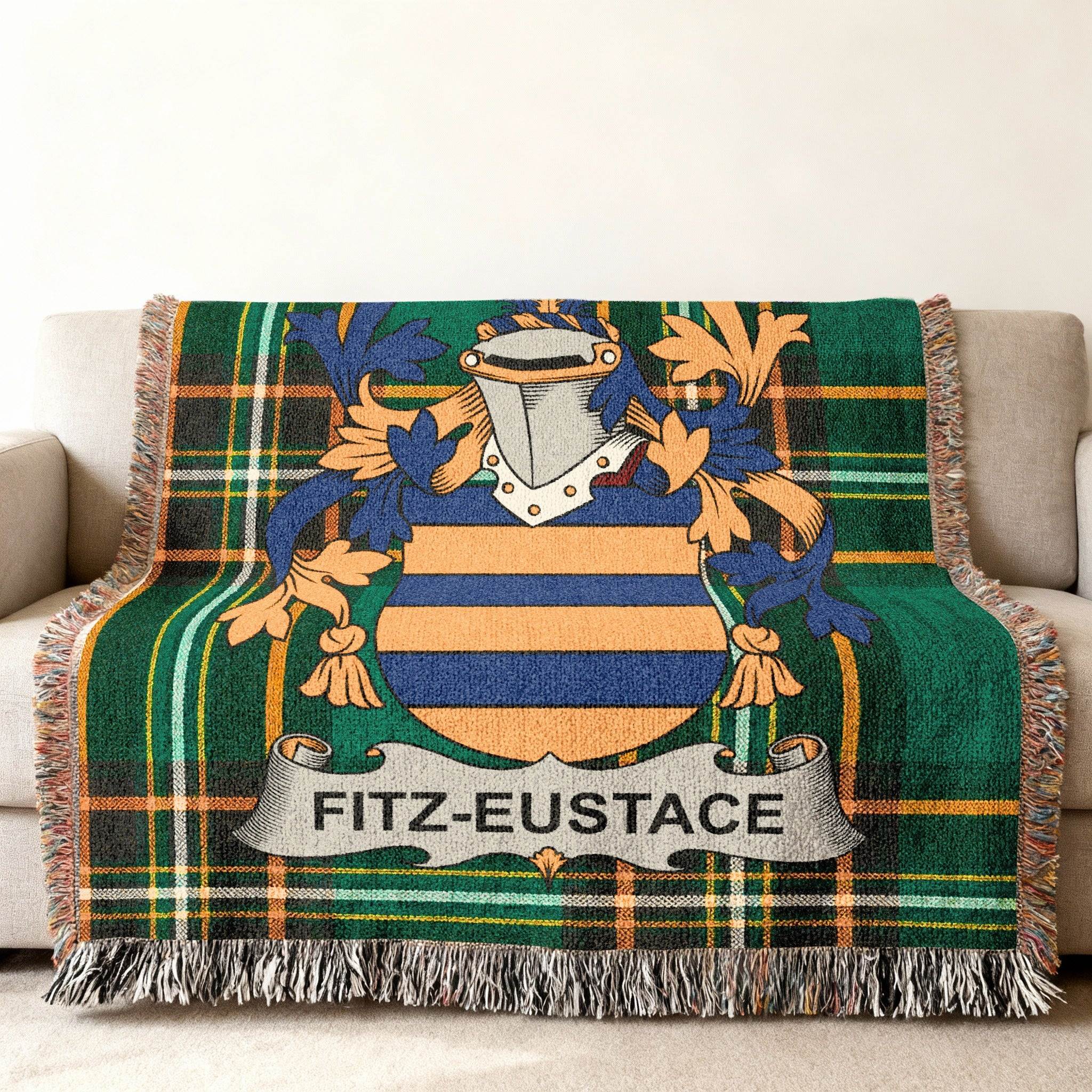 Fitz-Eustace family crest on a green plaid woven throw blanket.