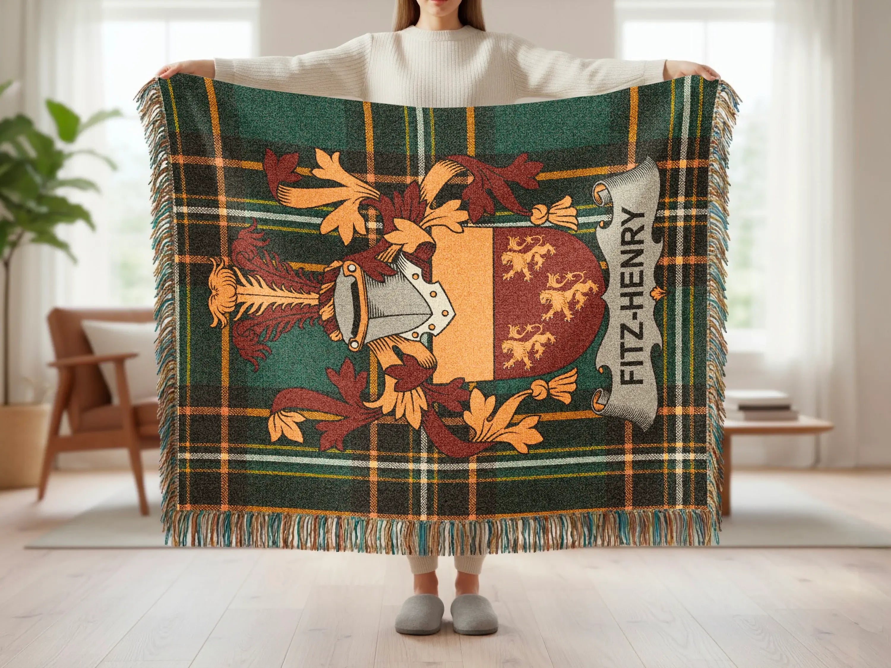 Fitz-Henry family crest on a green plaid throw blanket.