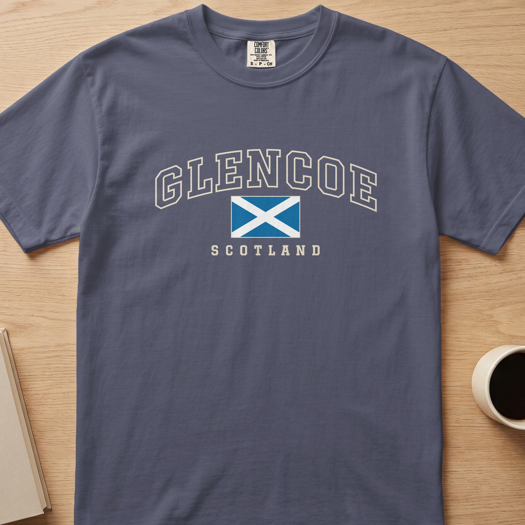 Denim Comfort Colors T-shirt laid flat with Glencoe, Scotland lettering and a blue-and-white Saltire