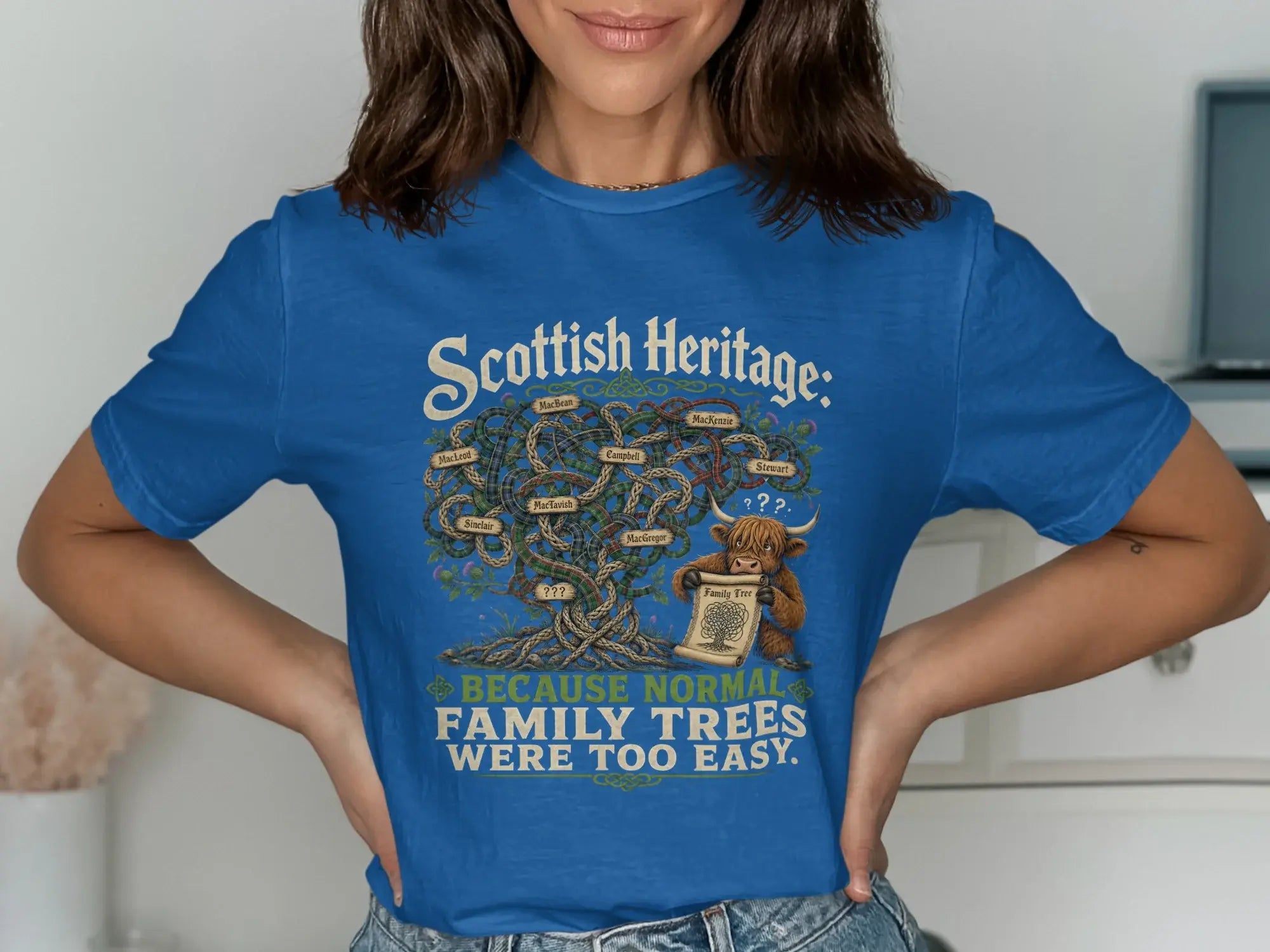 Blue t-shirt with "Scottish Heritage" tree and "Because normal family trees were too easy" text.