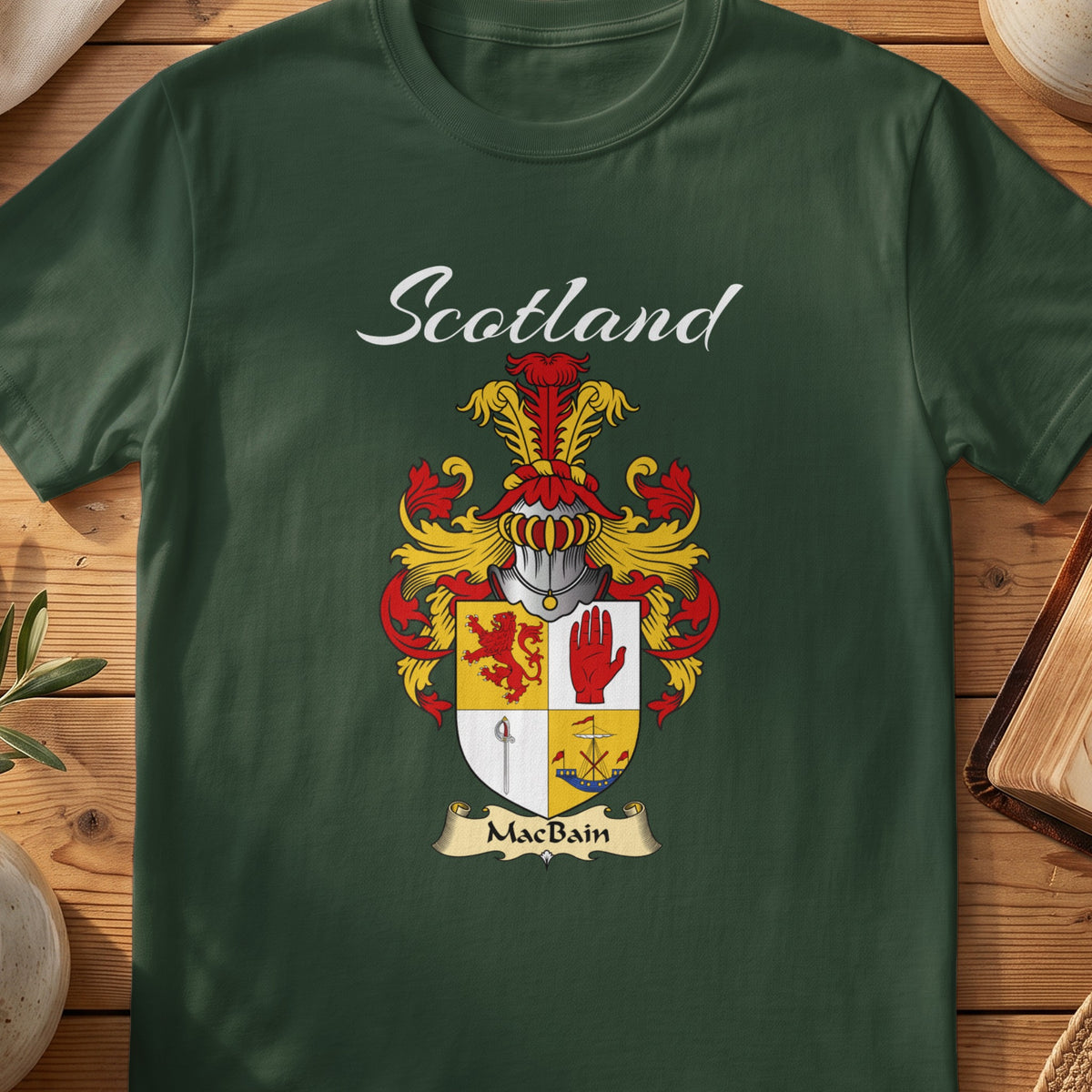 Forest Green MacBain Scottish T-shirt featuring a quartered shield featuring a red lion and an upright hand
