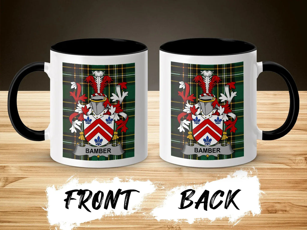 Two mugs with the Bamber family crest on a plaid background, front and back views.