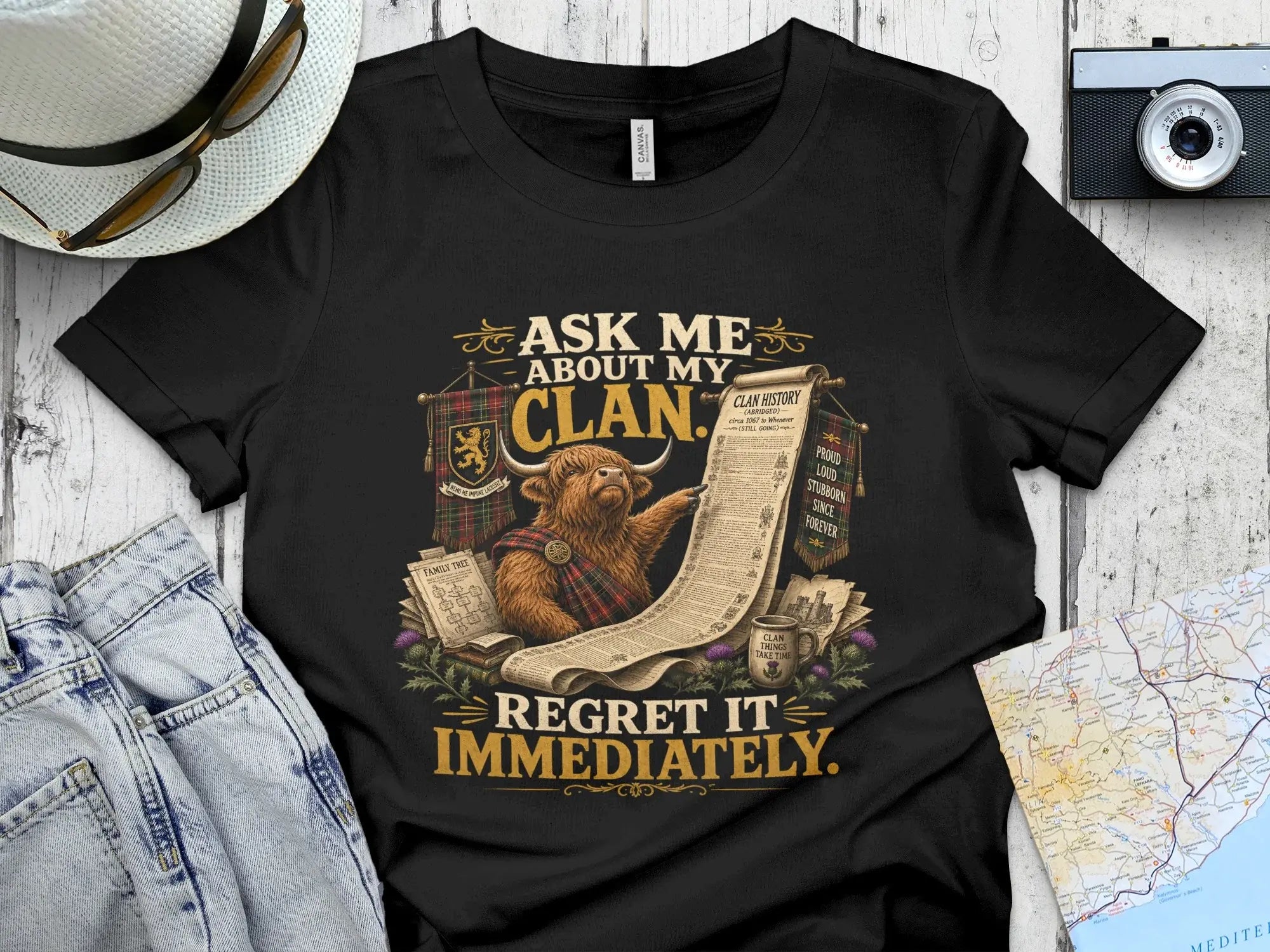 Scottish clan history t-shirt with Highland cow graphic and text.