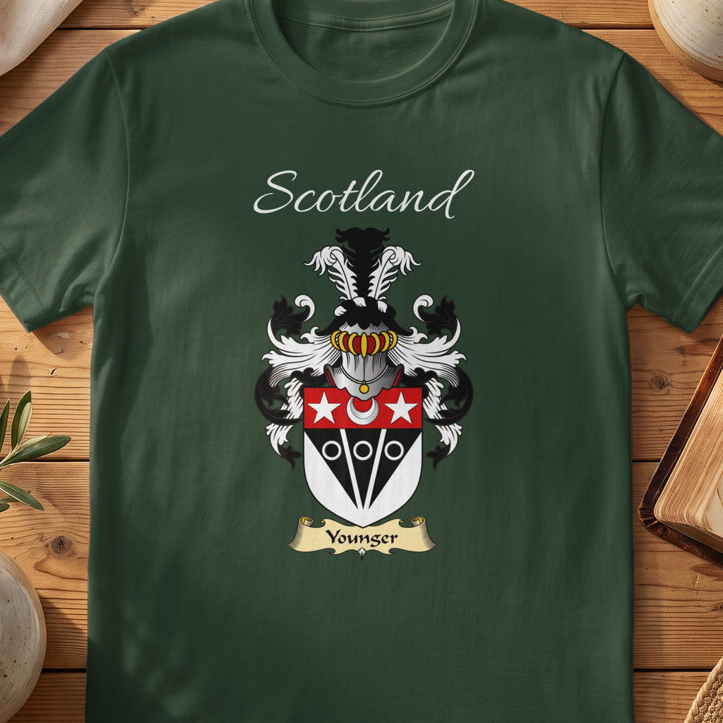 Forest Green Younger Scottish T-shirt laid flat with coat of arms artwork and “Scotland” text.