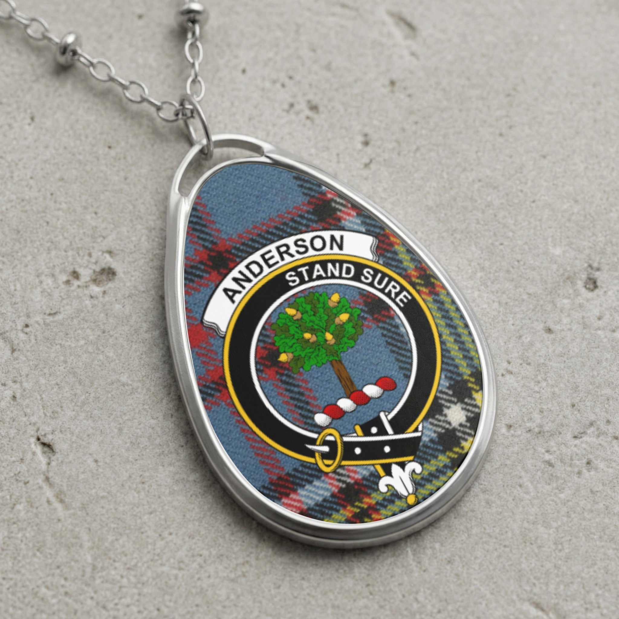Anderson clan Scottish tartan necklace with clan crest and Stand Sure motto on tartan background