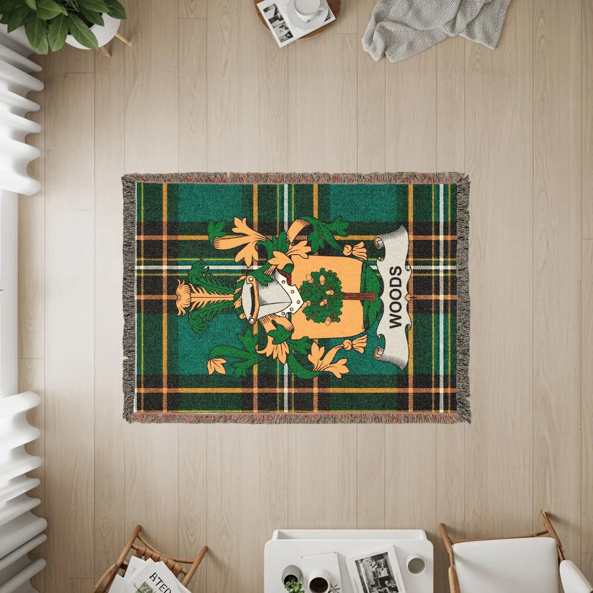 Tapestry with green, gold, and white plaid pattern and a family crest.