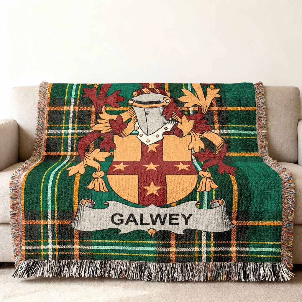 Tartan blanket with GALWEY crest displayed on a couch.