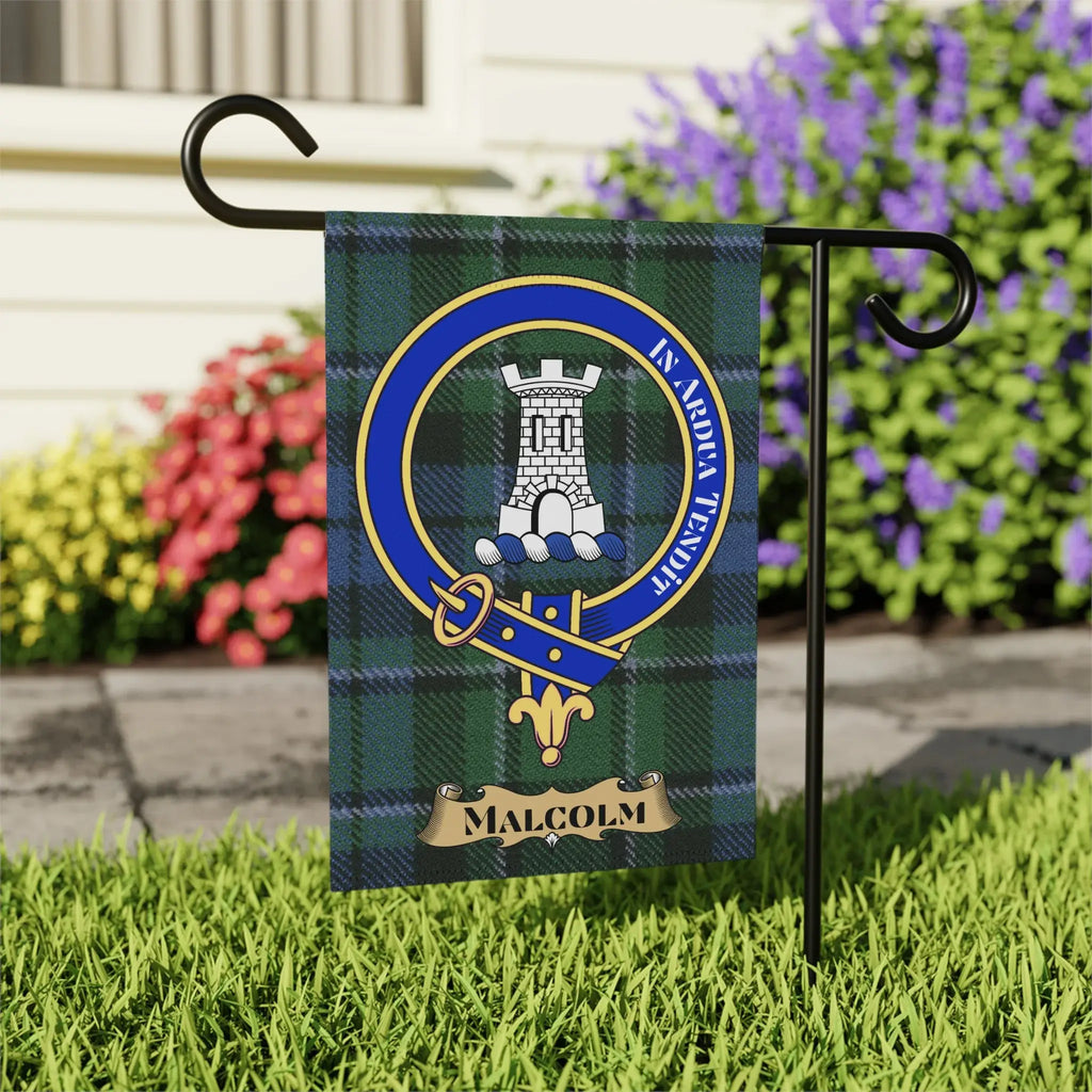 Malcolm clan crest garden flag displayed on standard stand — blue and green tartan with tower emblem