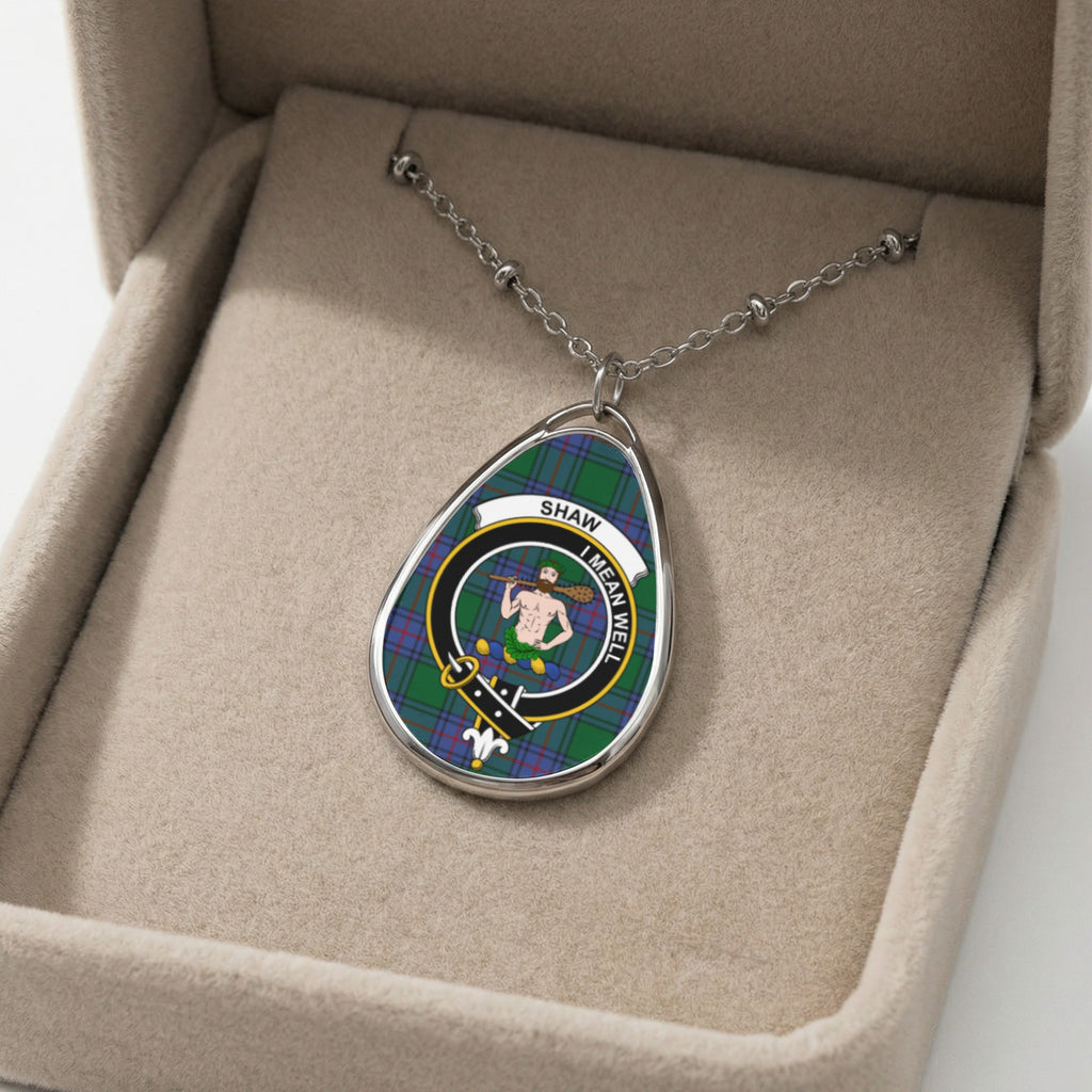 Shaw clan crest necklace with Scottish tartan pattern in a beige display box.