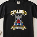 Spalding Scottish clan T-shirt in Black, front view with a stone tower with a red gateway and motto design.