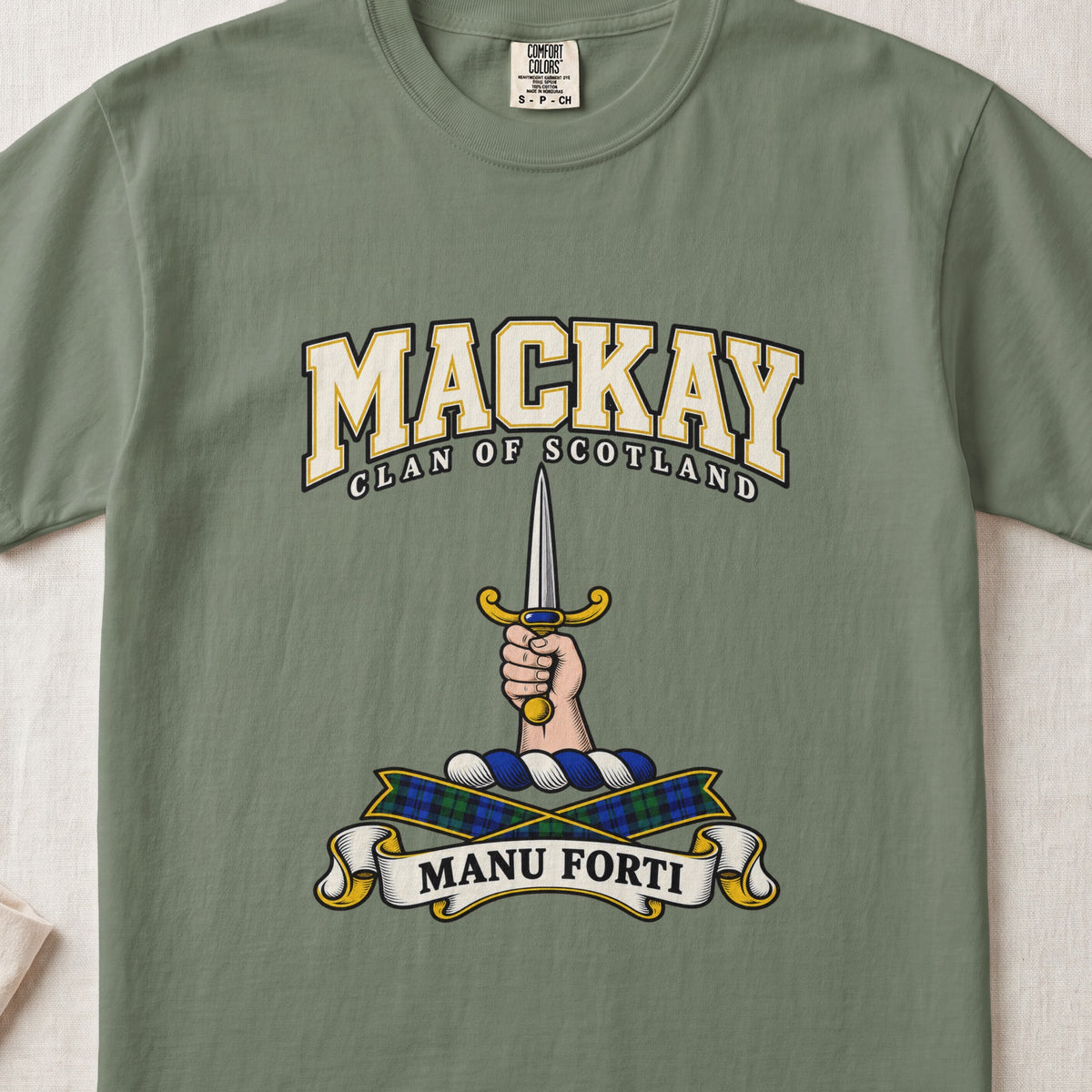 MacKay graphic T-shirt in Moss green, front flat lay showing varsity lettering and hand and forearm holding an upright silver dagger with gold hilt.