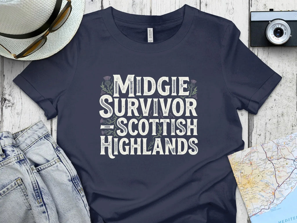 Dark t-shirt with "Midgie Survivor Scottish Highlands" text and thistle graphics.