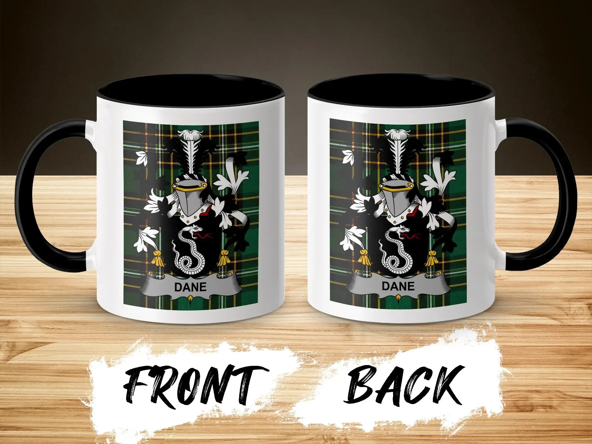Two white mugs with black handles, displaying a green plaid crest with the name "DANE".