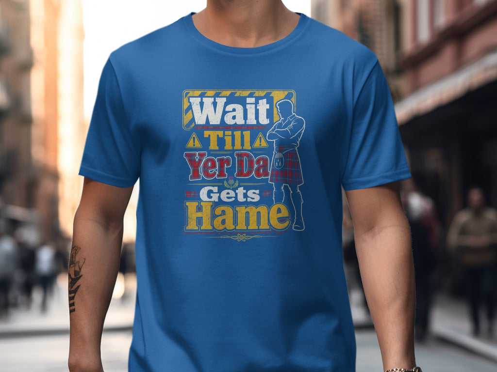 Blue t-shirt with "Wait Till Yer Da Gets Hame" text and kilted figure.