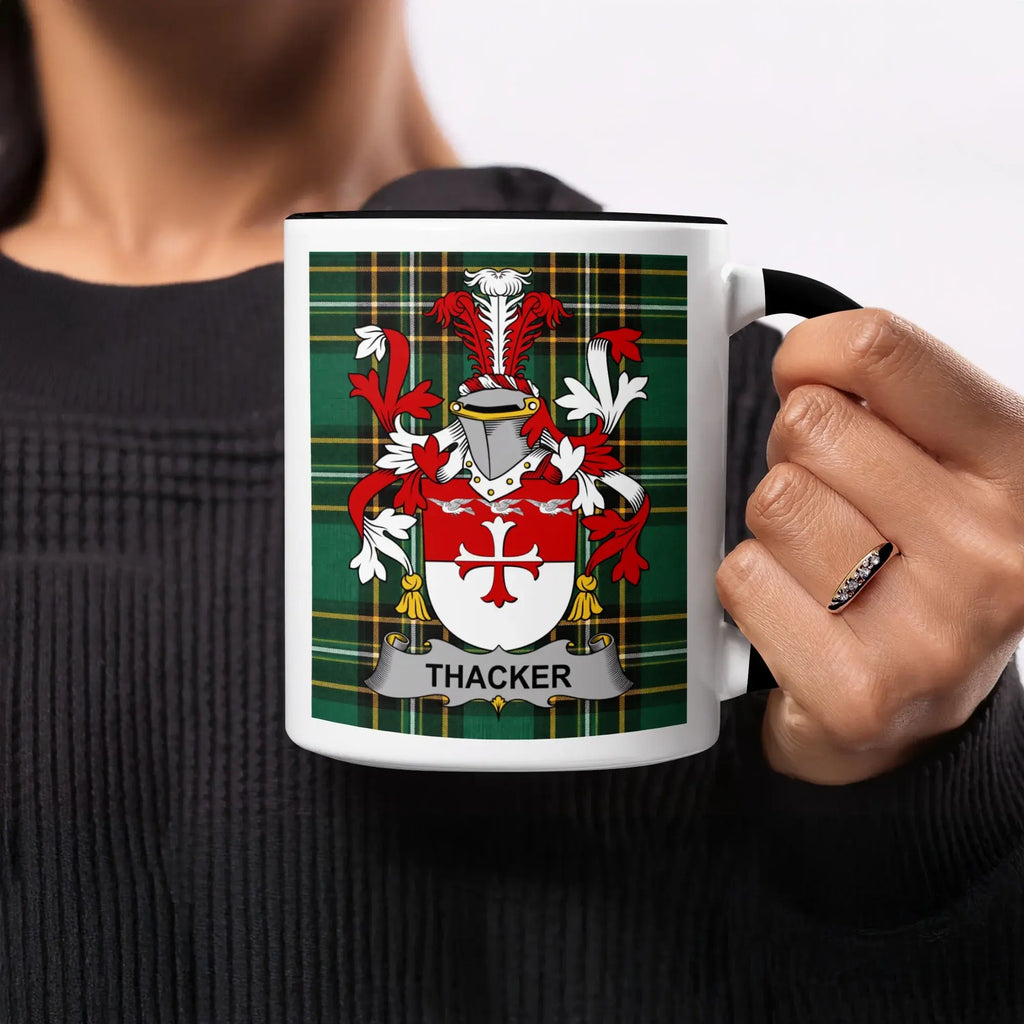 Thacker coat of arms on a white mug with a black handle and rim.