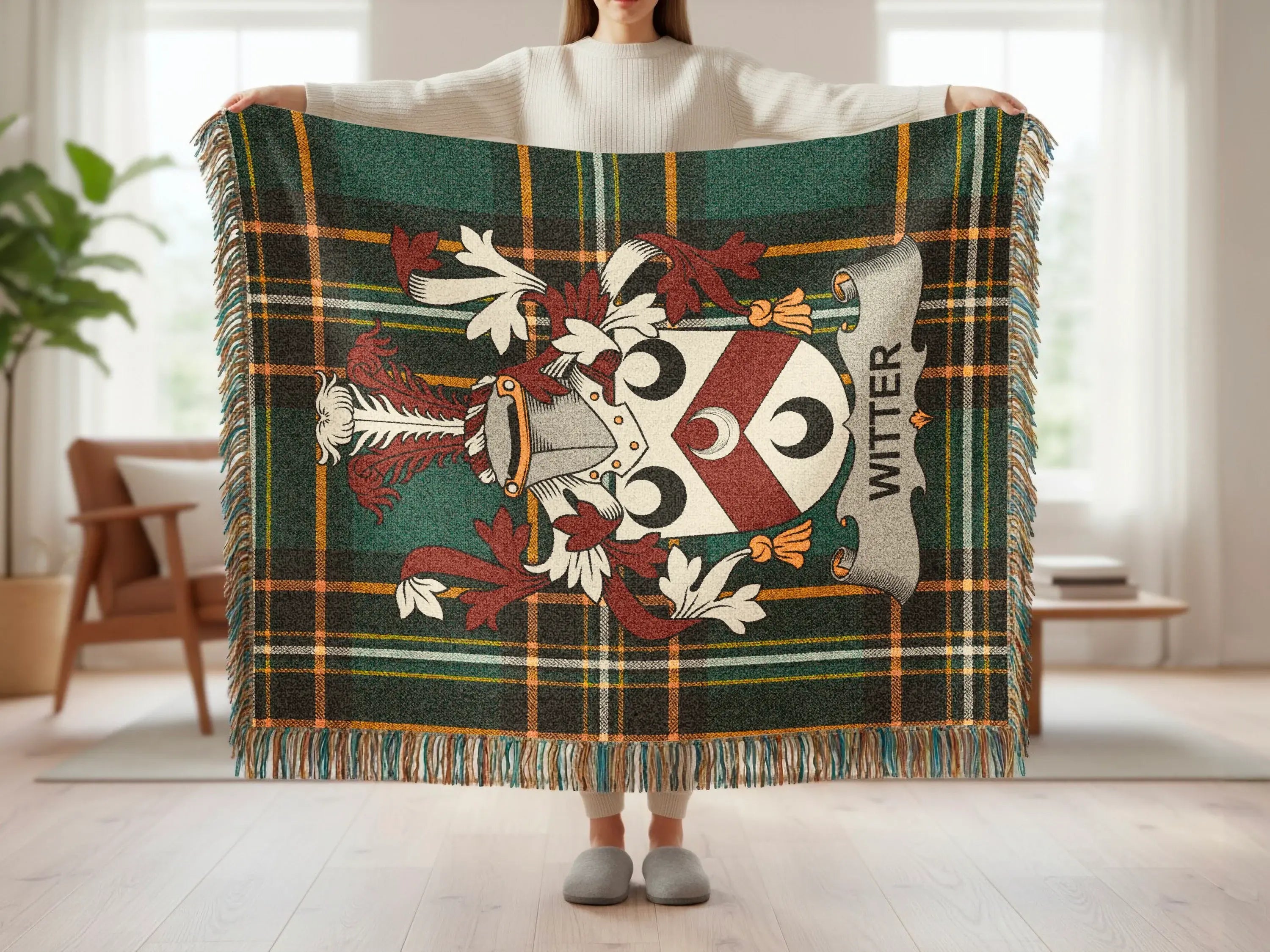 Green plaid throw blanket with family crest and "WITTER" text.