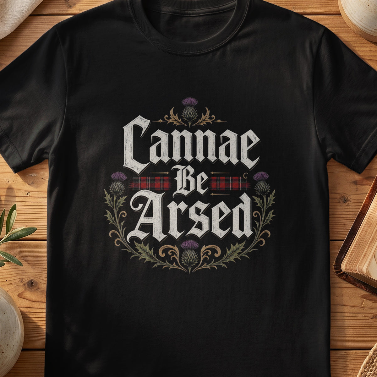 Black Gildan 64000 unisex T-shirt flatlay with Cannae Be Arsed Scottish graphic design