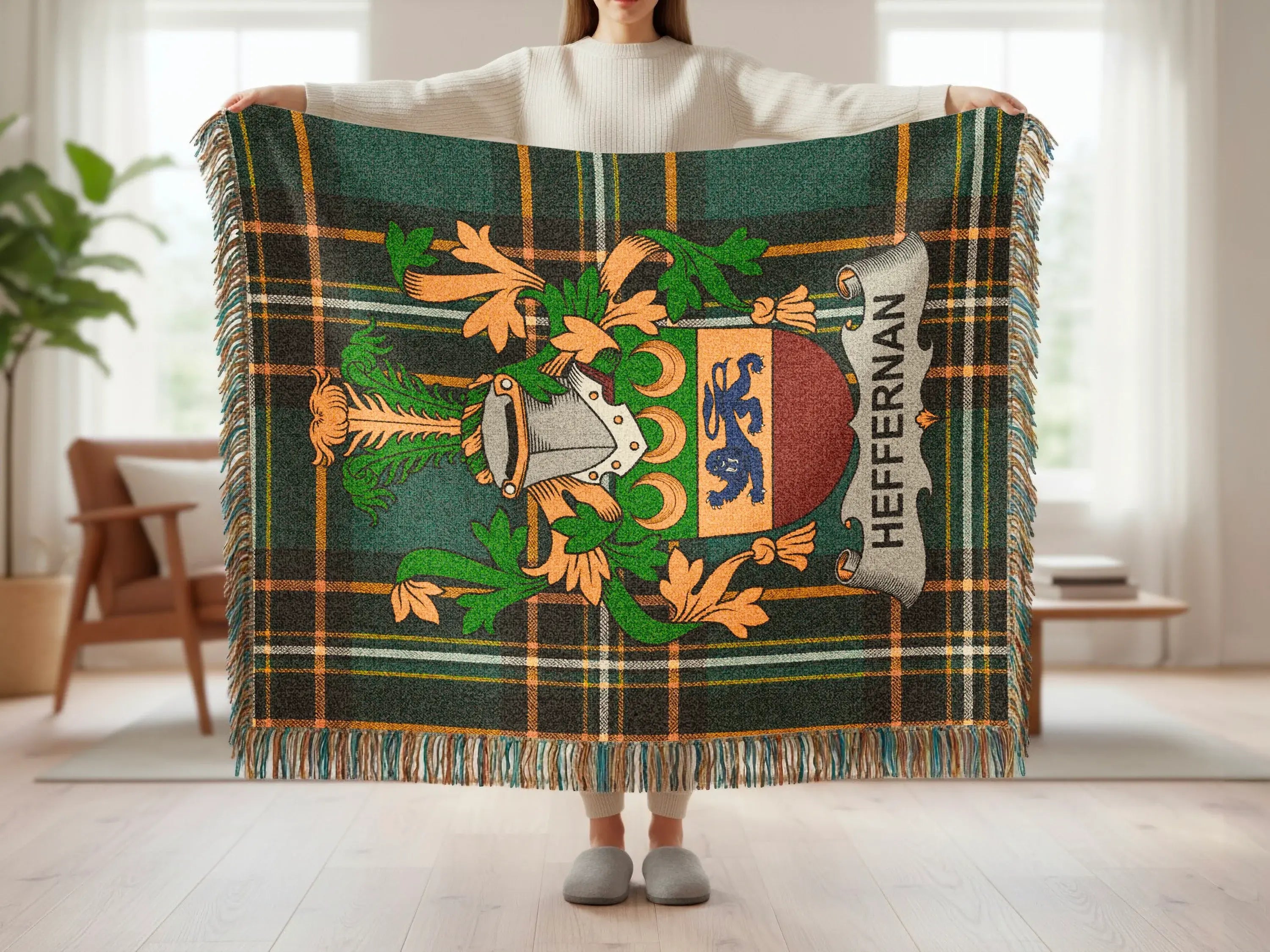 Plaid throw blanket with Scottish heraldry and the name "Heffernan."