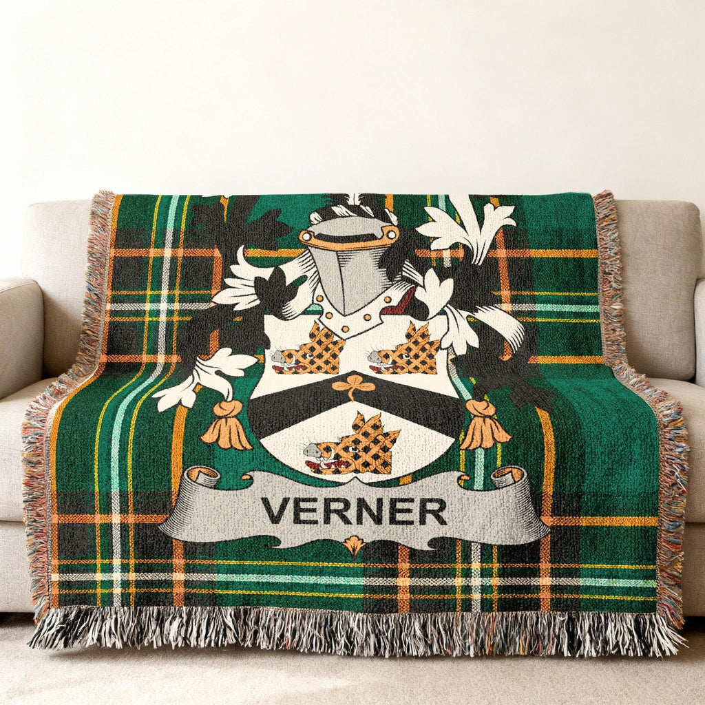 Tartan throw blanket with the "Verner" family crest in the center.