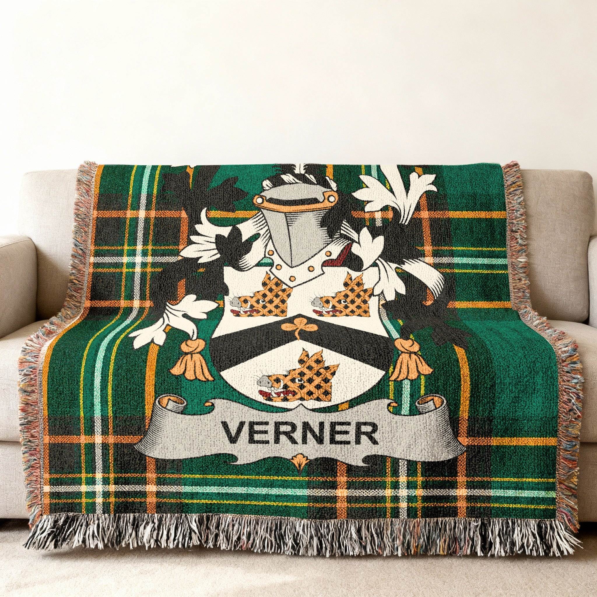 Tartan throw blanket with the "Verner" family crest in the center.