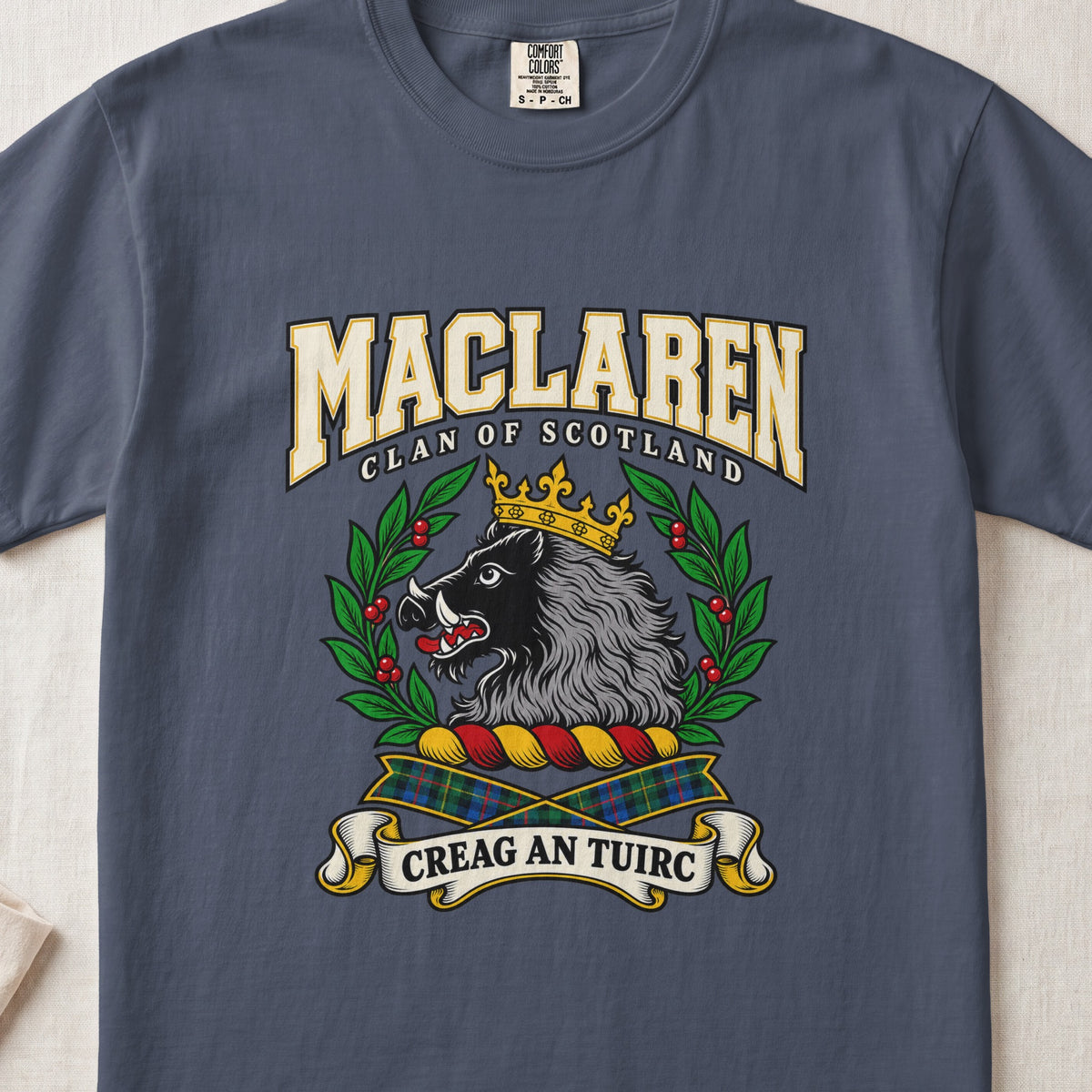 MacLaren graphic T-shirt in Midnight blue, front flat lay showing varsity lettering and crowned black and grey boar head with white tusks.