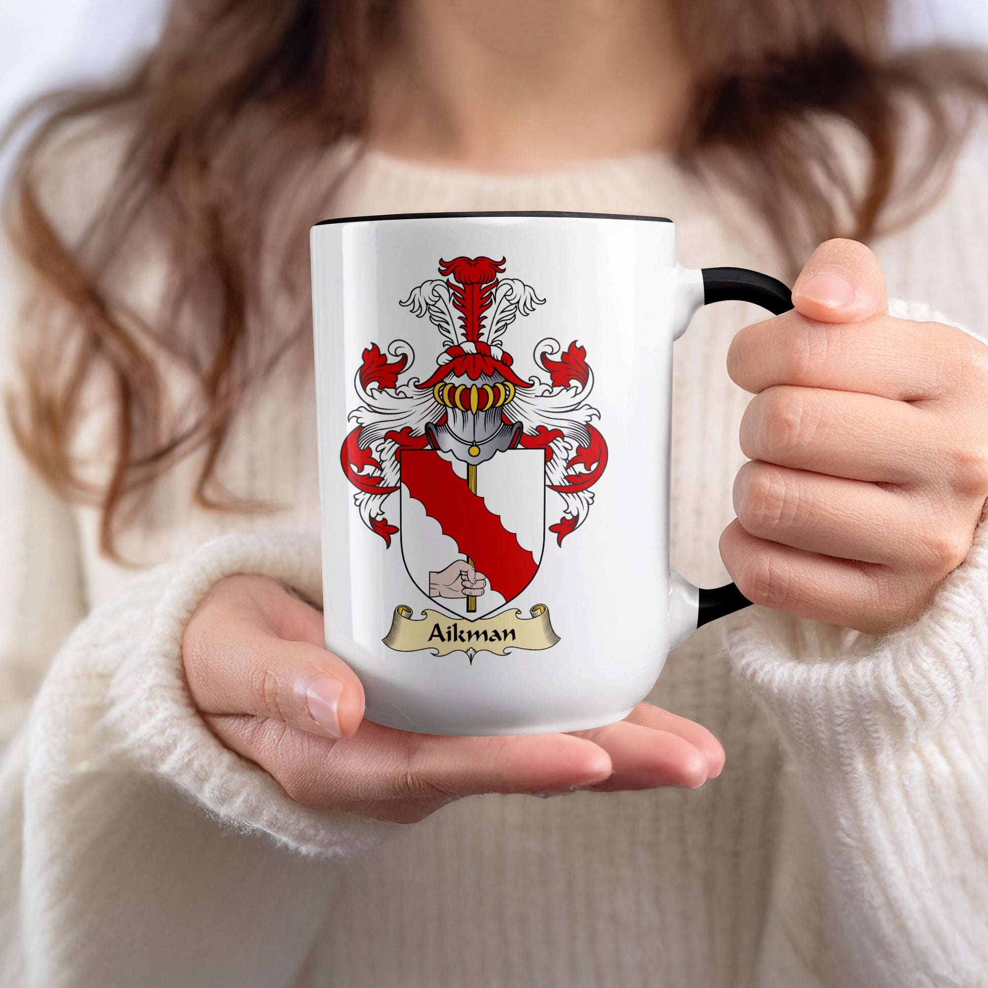 Mug with a coat of arms featuring a red diagonal band and the name Aikman.
