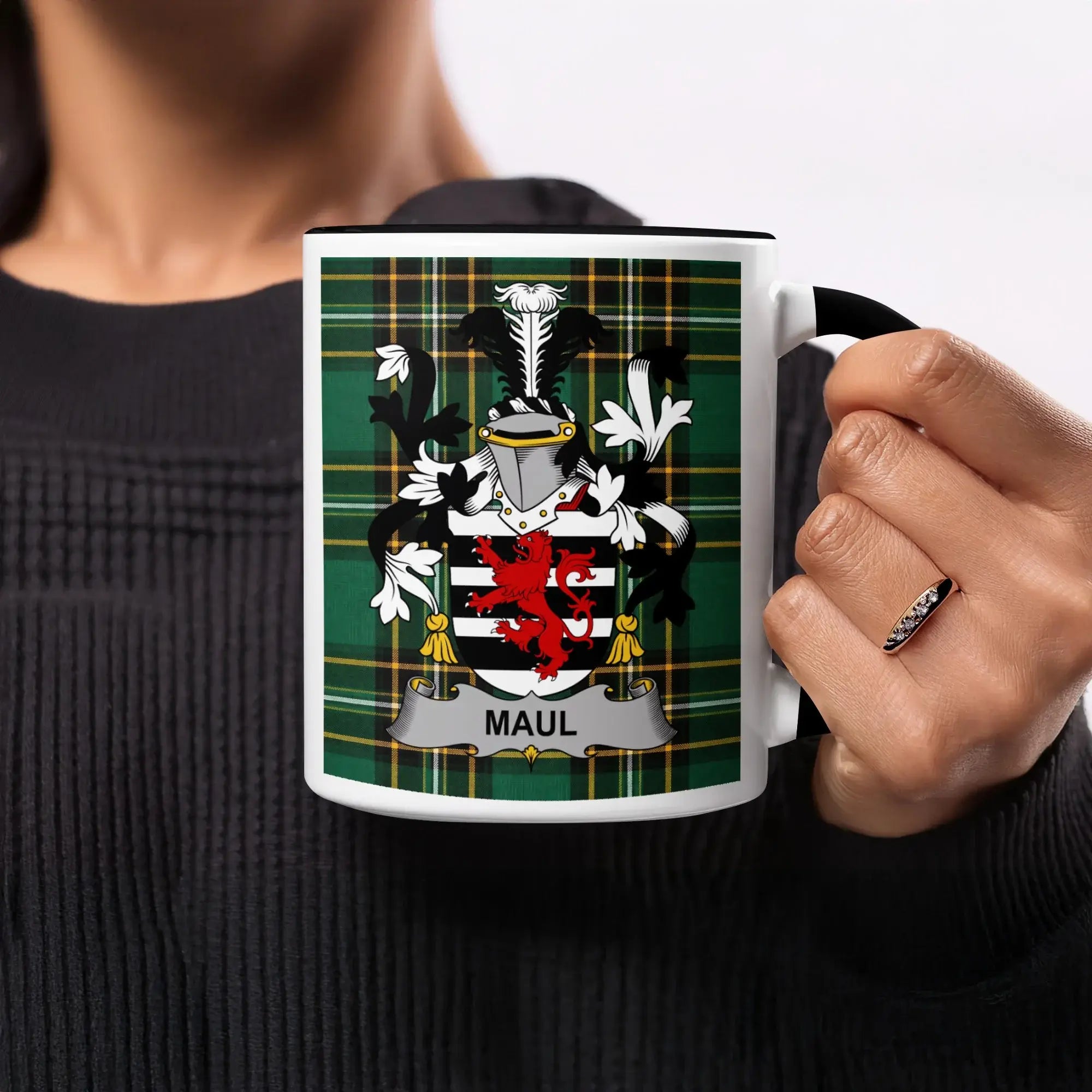 Mug with a coat of arms featuring a black lion on a red background and the name MAUL.