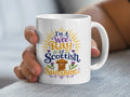 White mug with "I'm a wee Ray of Scottish Sunshine" text and a Highland cow.