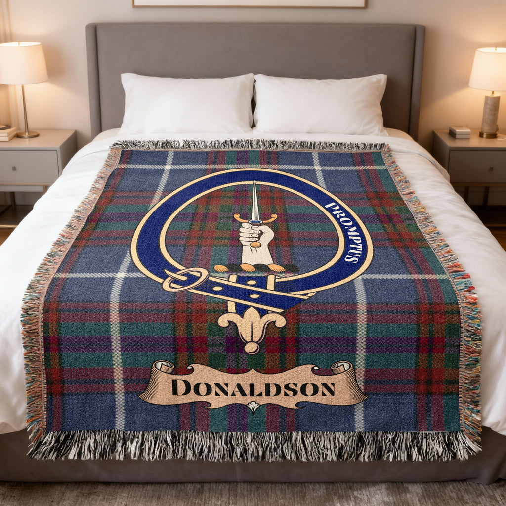 Donaldson clan crest tartan woven blanket displayed on a bed — 100% cotton