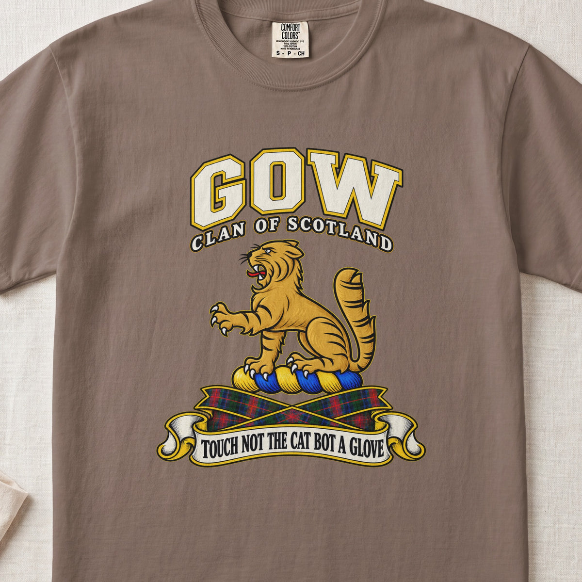 Gow Scottish clan T-shirt in Espresso, front view with a golden wildcat and motto design.