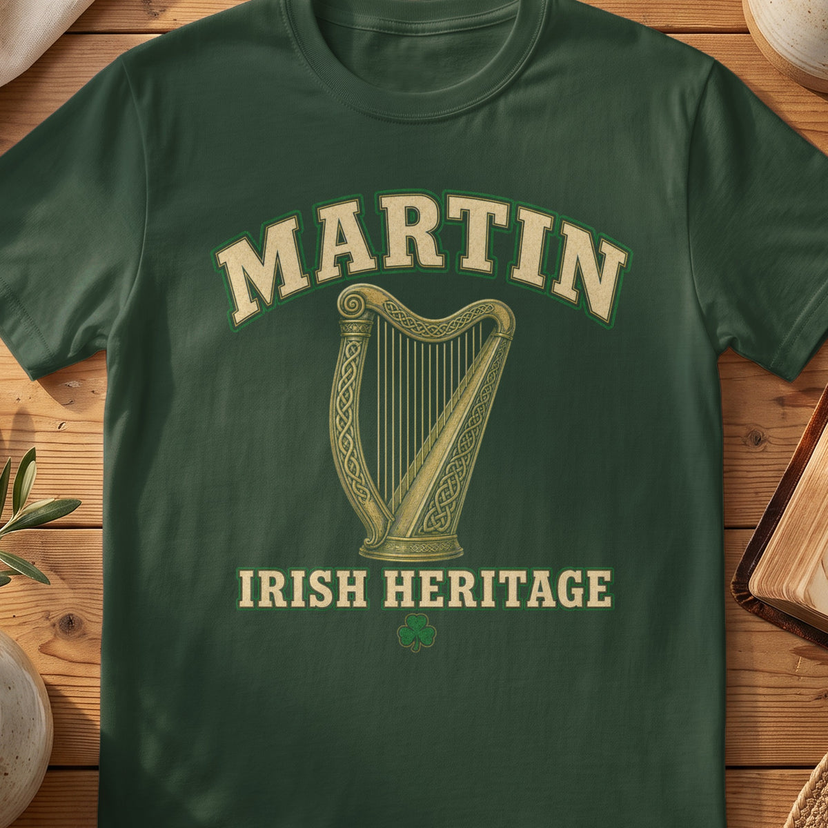 Martin Irish harp T-shirt in Forest Green, with cream surname lettering, a gold-toned harp, green shamrock and “Irish Heritage” text.
