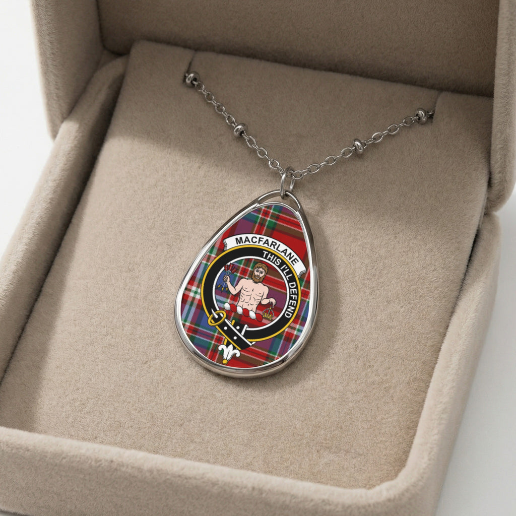 Macfarlane clan crest on oval pendant with tartan background, in a jewelry box.