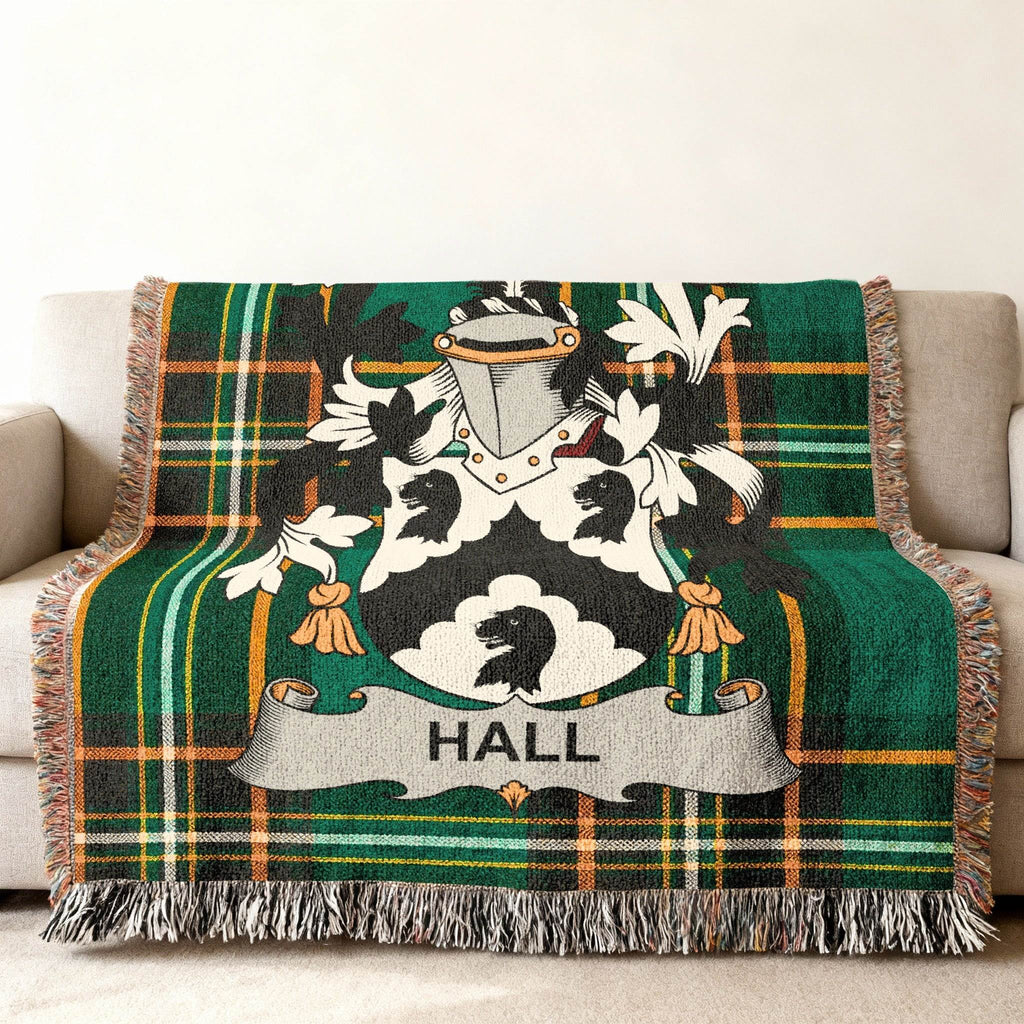 Green plaid blanket with a Hall family crest featuring a black bear.