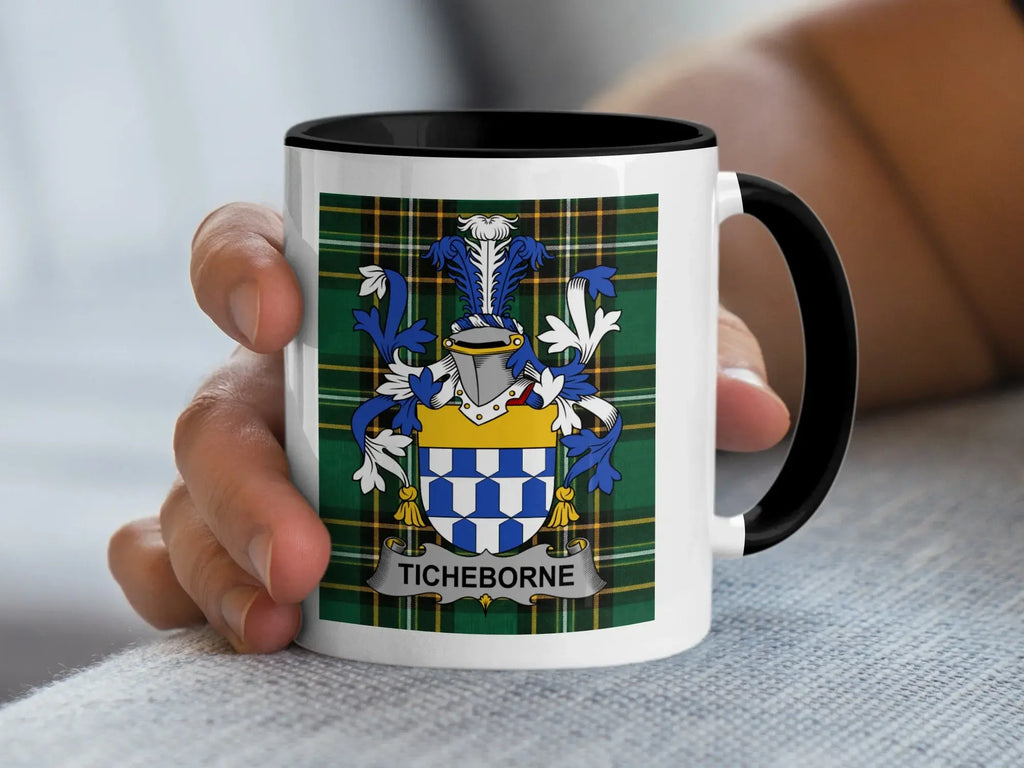 White mug with black rim featuring the Ticheborne family crest on a tartan background.