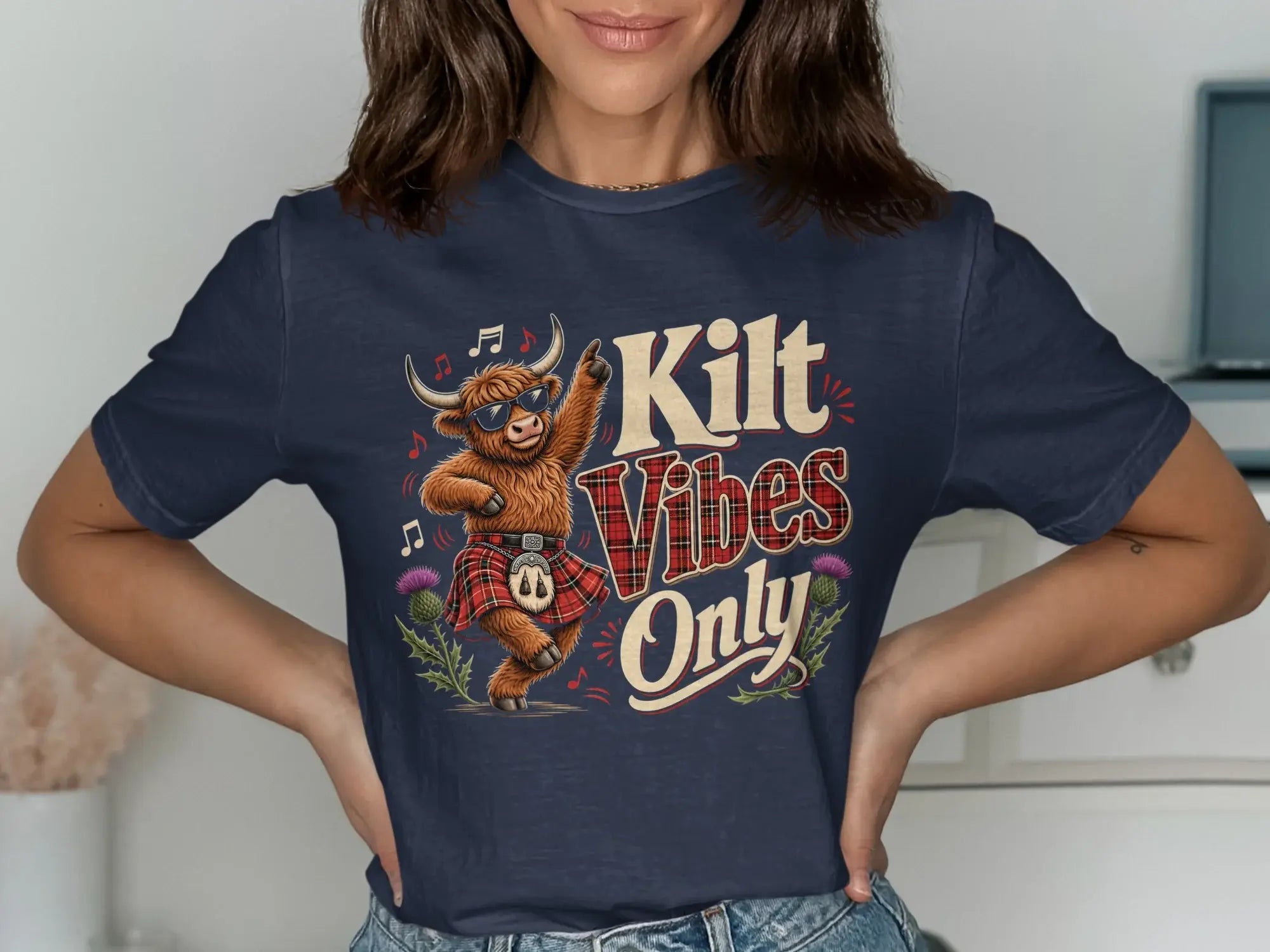 Highland cow wearing sunglasses and kilt, dancing with "Kilt Vibes Only" text.
