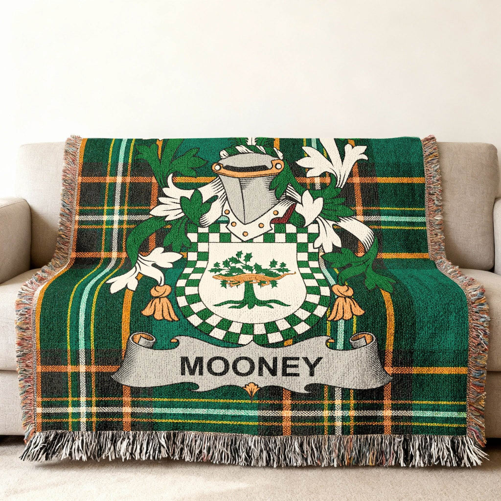 Green tartan throw blanket with Mooney family crest.