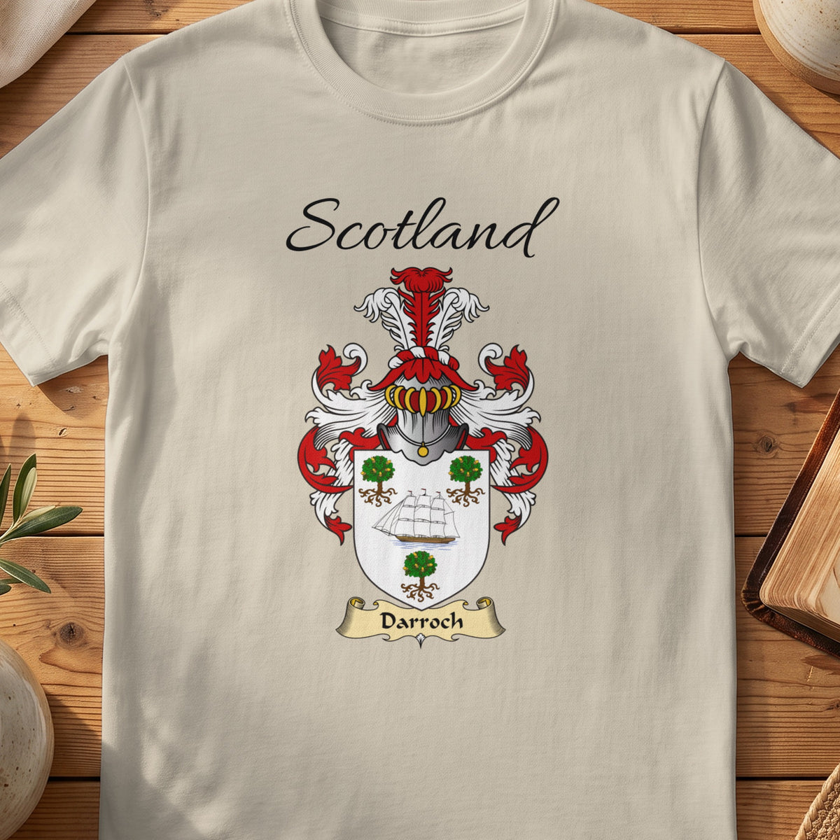Sand Darroch Scottish family shield T-shirt featuring a ship and green tree motifs on a pale shield
